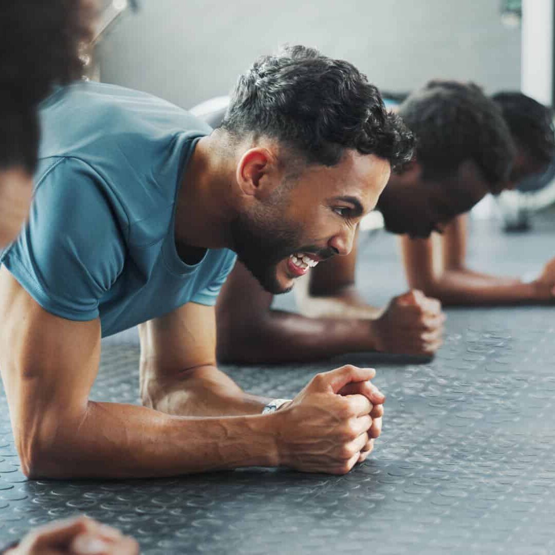 img-head Exercise, plank and power with group friends on gym floor together for training or workout. Fitness, strength and sports with athlete people in health club for intense challenge or performance